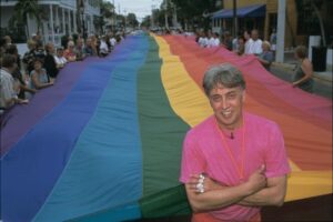 Gilbert Baker with the pride flag